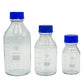 Three clear glass bottles with blue lids on a white background