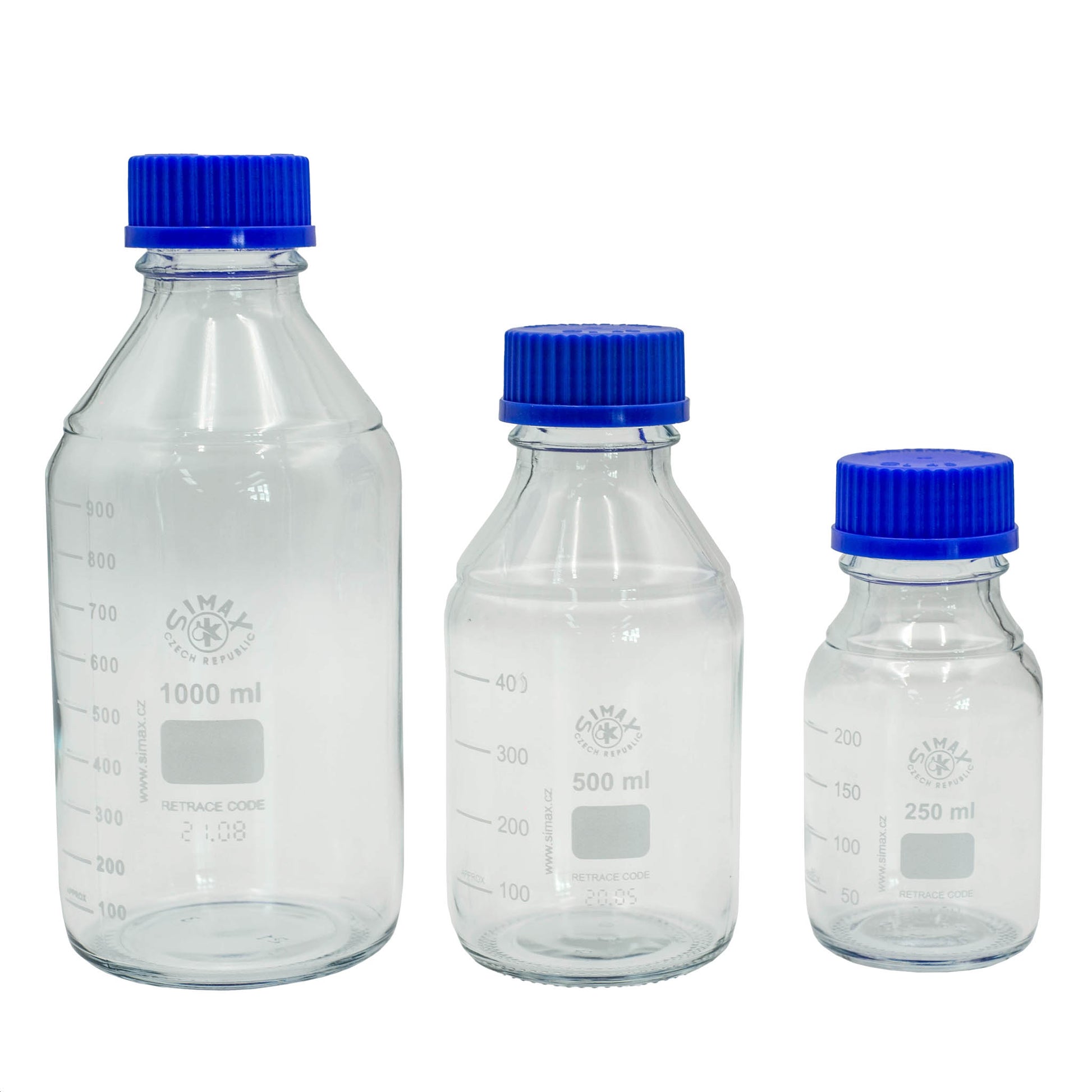 Three clear glass bottles with blue lids on a white background