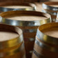 close up of wooden wine barrels with silver bands
