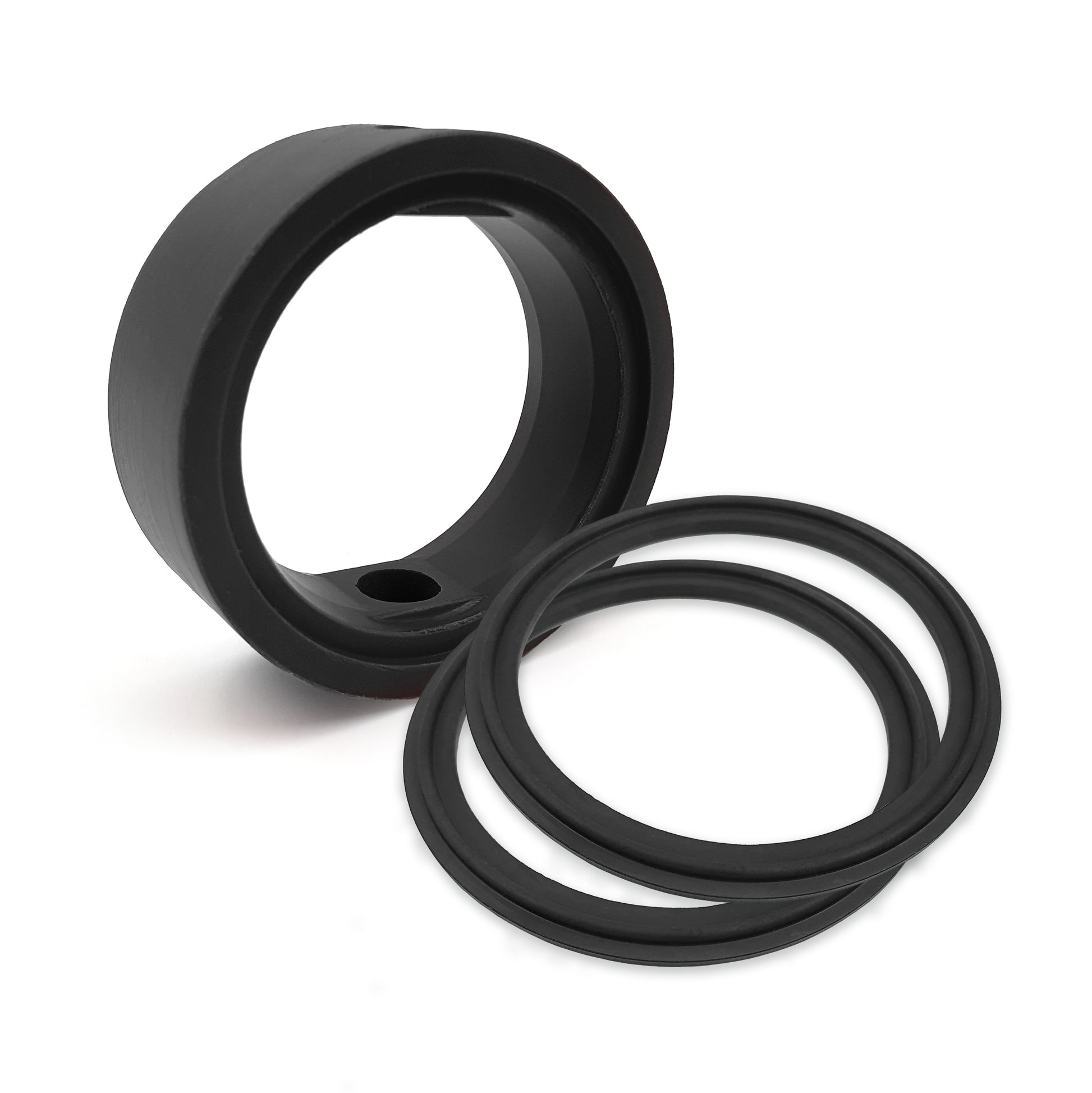 Two black rubber seals on a white background