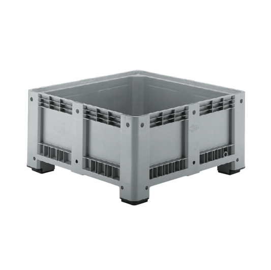 A gray plastic industrial capp plast harvest bin with a slotted open top and black feet, shown on a plain white background.