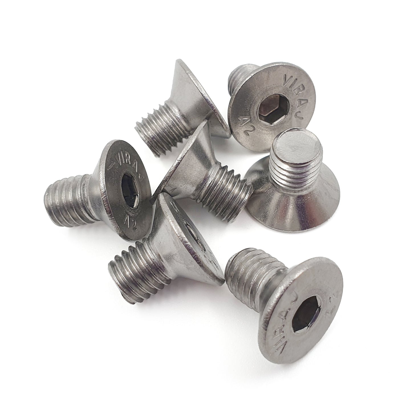 Set of metal screws on a white background