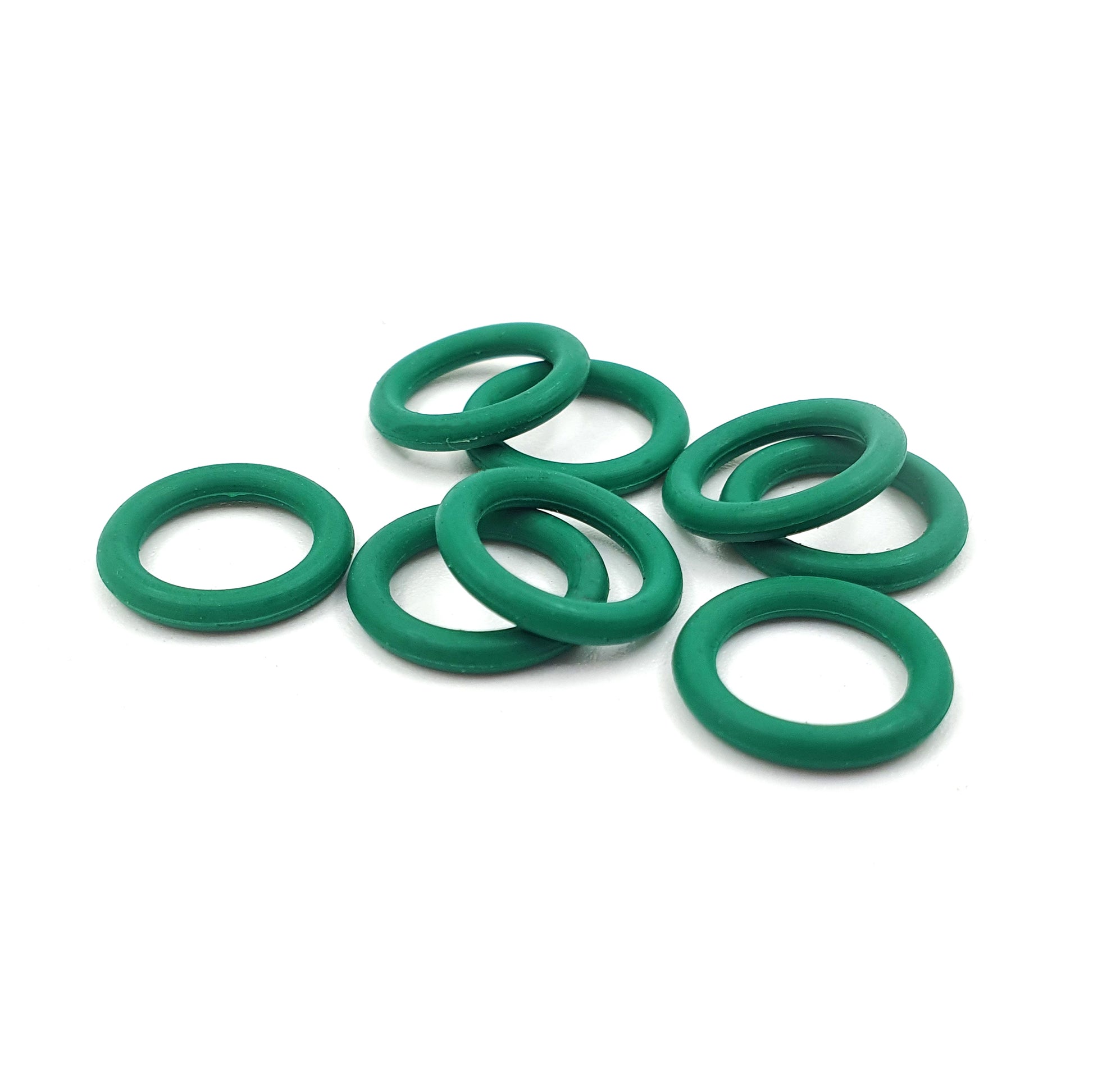 Green rubber o-rings on a white background