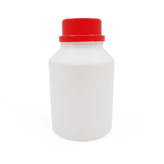 White bottle with a red cap on a white background