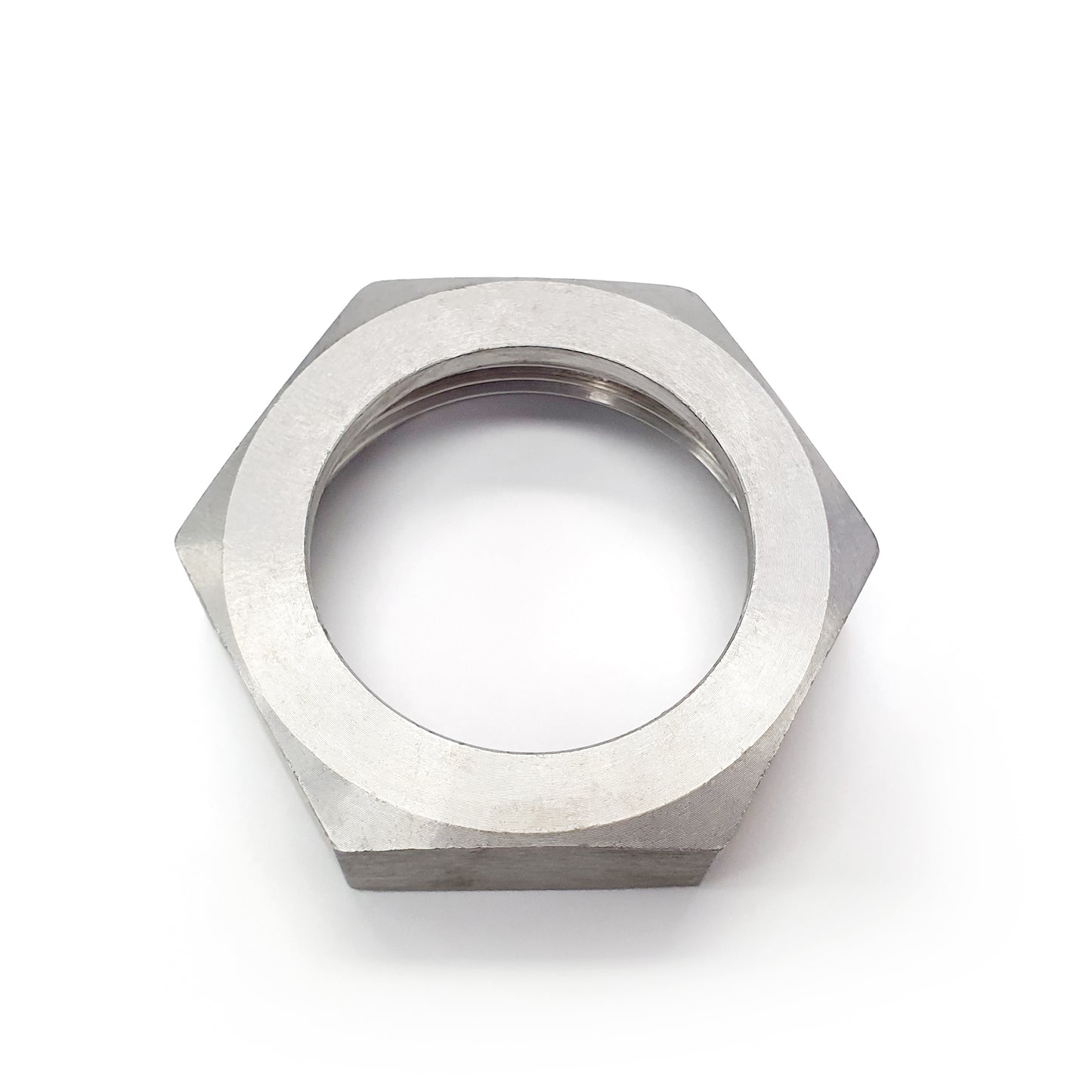 Metallic hex nut on a white background