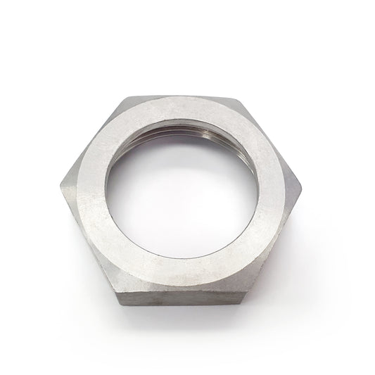 Metallic hex nut on a white background